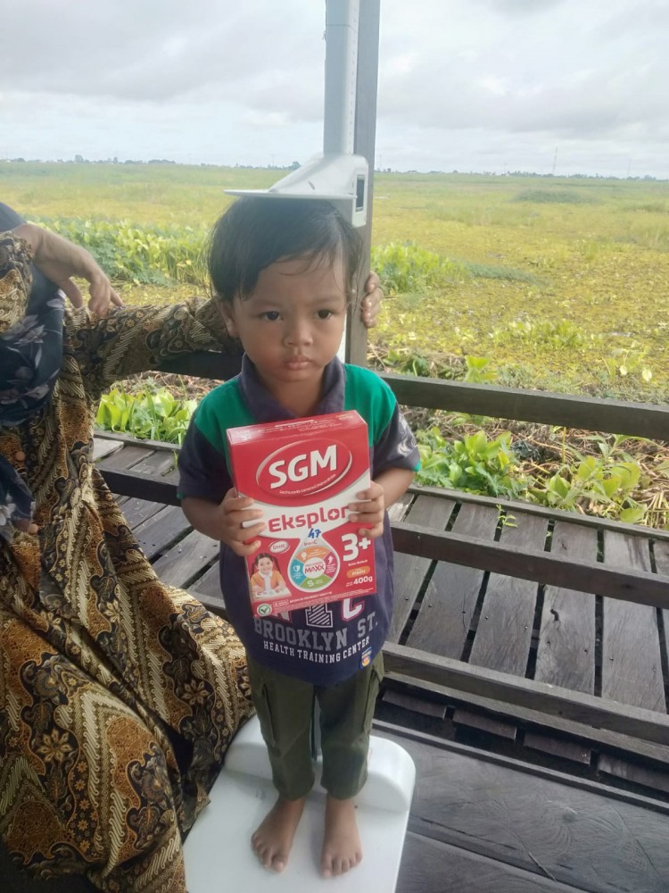 pembagian susu posyandu belita dan ibu hamil desember